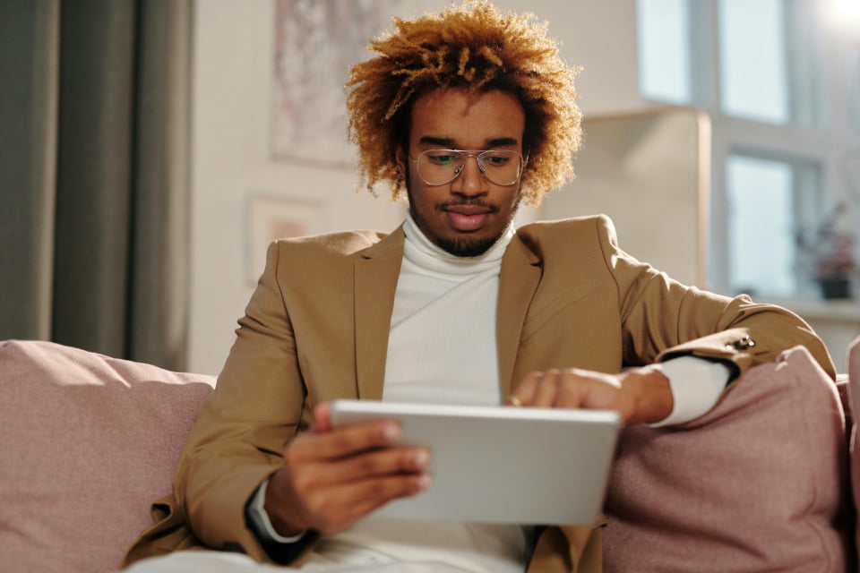 professional man getting help on tablet